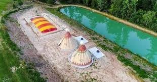 One of several ponds, Teepees for rent and a bounce pillow for the kids.