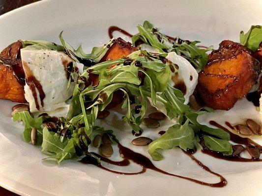 Burrata with crispy sweet potatoes, arugula and pumpkin seeds