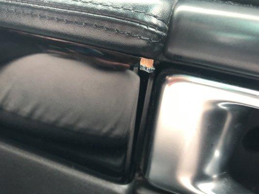 Black wood panel on inside if driver door has large chip from removal or tool