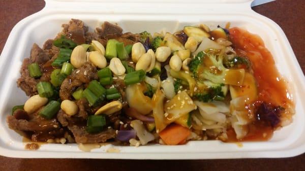 Beef and vegetables with brown rice and General Tso's sauce with a dash of peanut sauce. $7.75 was the price. Delicious!