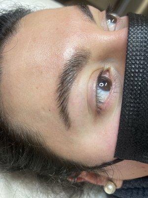 Eyebrow lamination and with tint and shaping.