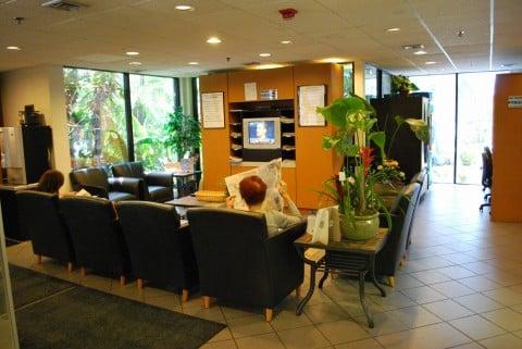 spacious comfortable cusotmer lounge with refreshment, snacks and business center.