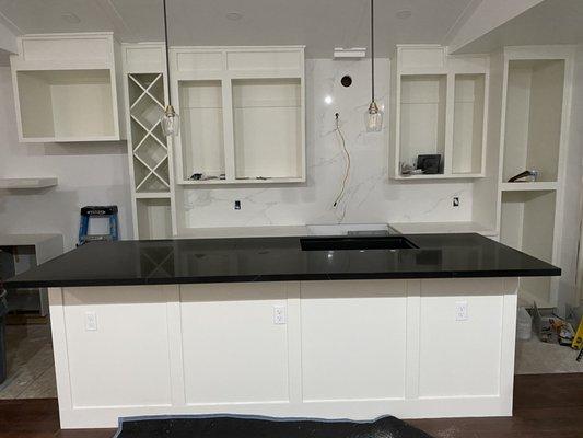 Island countertop, back countertop, and backsplash work done.