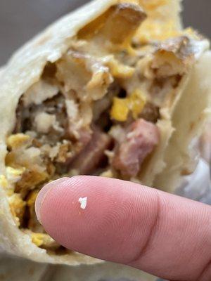 Egg shell pieces in burrito, annoying! Trashing it.