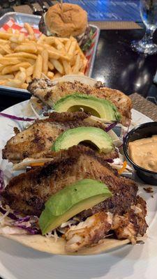 Fish tacos on flour tortillas and the two-patty burger with fries