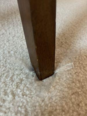 Little plastic squares under every table and chair leg