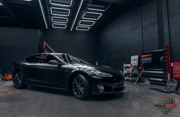 Tesla Model S in SATIN BLACK full wrap and chrome delete