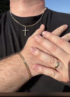 Gold wedding band, bracelet and cross