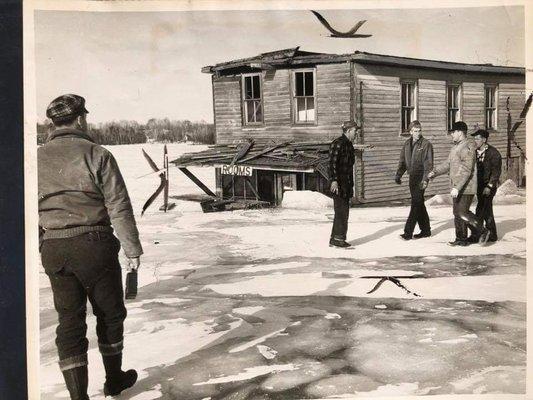 The "Eastport Inn" halfway through the Ice of Torch Lake. The building was built in 1866 and moved to Brownwood Acres in 1956.