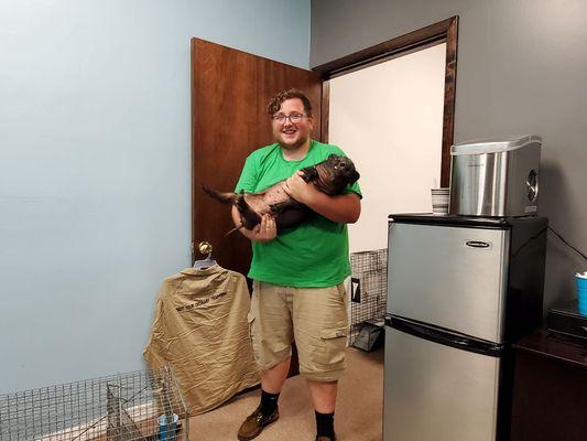 Wild boars aren't as mean as they say. Here's one of our techs holding him to calm him down after he was rescued.