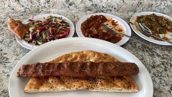 Adana kebab is served with fresh sides