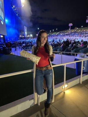 Kettle corn and wine stand next to the floor seats.