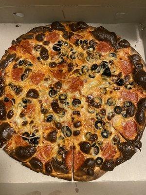 Pepperoni, onions, black olives, and a request to have it well-done.