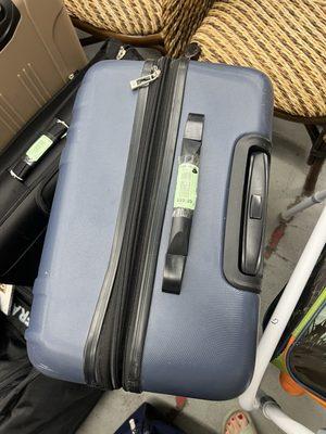 Disgusting ripped luggage for $60