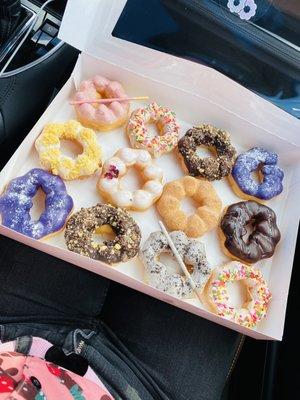 L to R: strawberry, B-day cake, chocolate crunch, Ube, lemon crunch, lychee rose, churro, chocolate and caramel, _,_, cookies'n cream,_