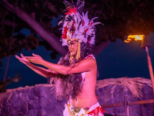 Woman performing hula dance and highlighting Polynesian culture