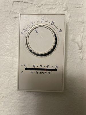 Ancient Thermostat that is set to 60. But is actually at 80.