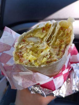 Breakfast burrito with egg, potato, bacon and cheese