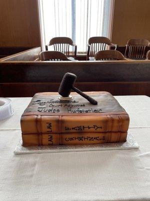 The cake was made to look like law books.