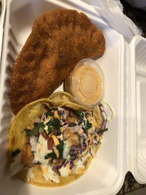 Empanada and shrimp taco