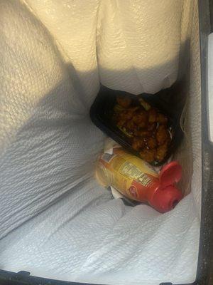 Orange chicken in the trash