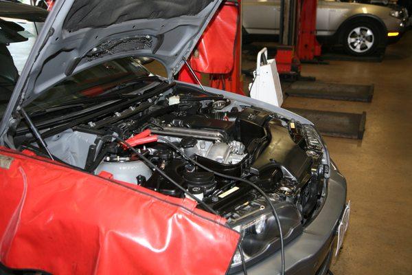 Always use a fender cover to protect the vehicle when work is in process.