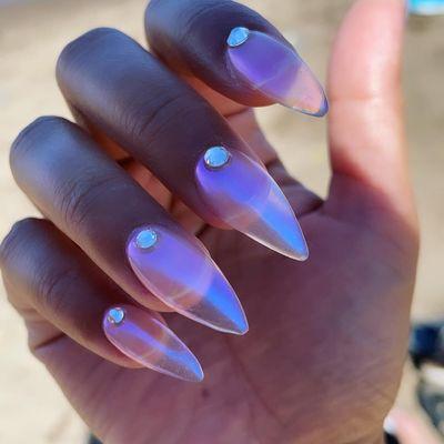 Clear nail with holographic powder with diamonds