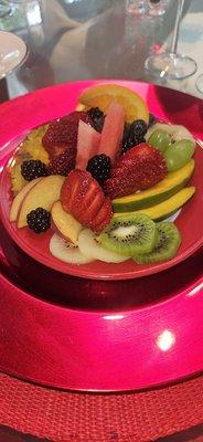 Fresh fruit over yogurt.