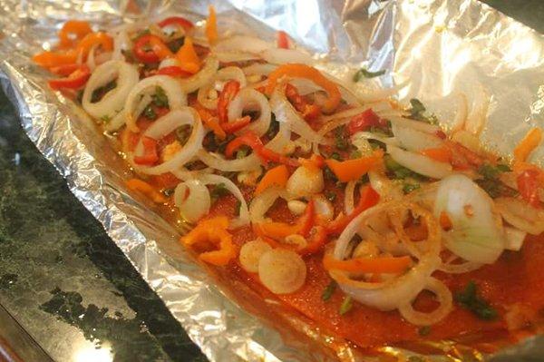 Wild Caught Salmon sauteed with fresh peppers and onions