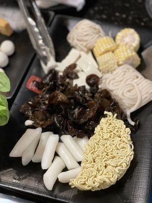 Rice cake, ramen, mushroom, udon, corn, tofu, shanghai noodles