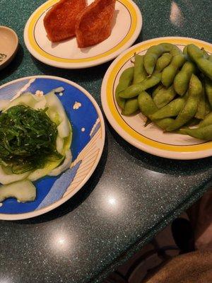 Inarizushi, seaweed salad and edamame.