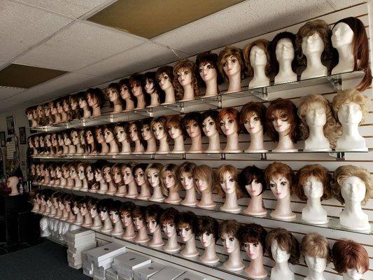 Shelves with wigs. One of the walls