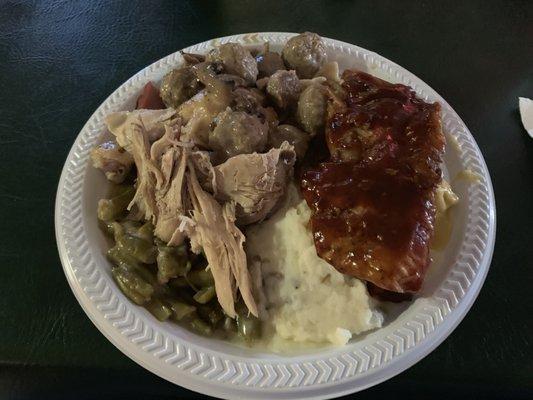 Mashed potatoes, turkey, ham, ribs, meat balls with mushrooms, and green beans and beef stroganoff.