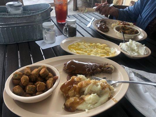 Salisbury steak special with mashed potatoes and fried okra, side Over easy eggs, and side cottage cheese.