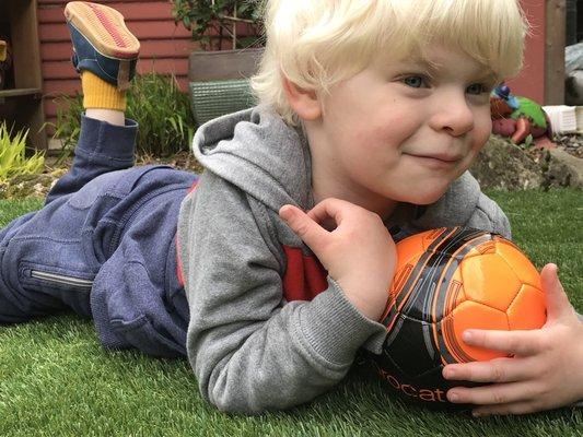 Future timber in training. Enjoying the new, all-weather synthetic lawn