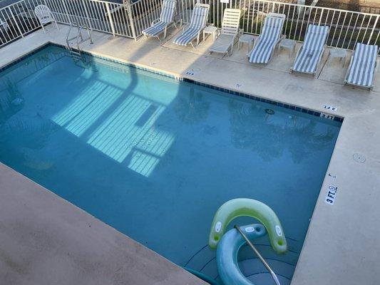 Pool is only a few steps from your room. They also have chairs & towels for the beach.