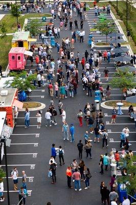 Employee appreciation event overview - multiple food trucks, beer & wine bar service, on-site management and staff, rentals and games