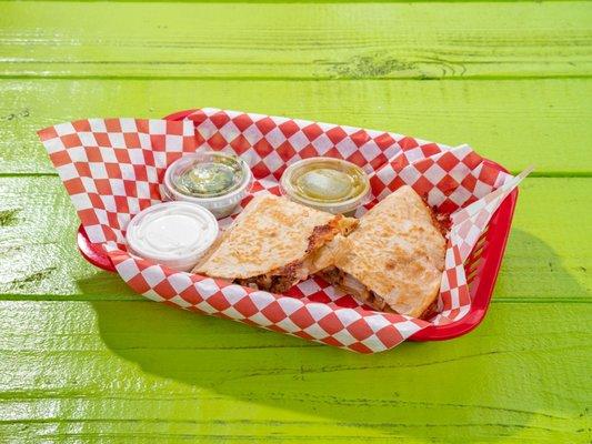 Quesadilla side of sour cream and guacamole