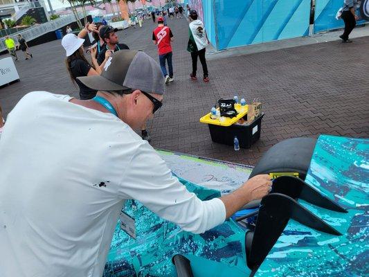 artist Remote roc painting a car