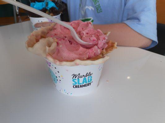 Strawberry ice cream in a waffle bowl from Marble Slab.