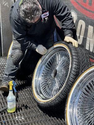 Ruben prepping a Vogue Tyres mounted on a set of wire wheels