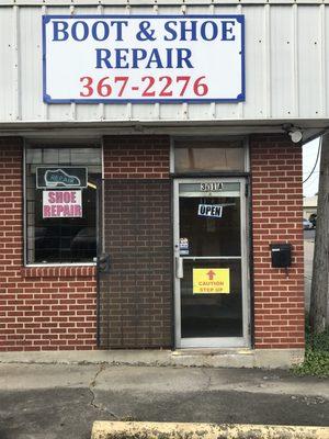 View of Entry for Moran's Boot & Shoe Repair from the parking lot.