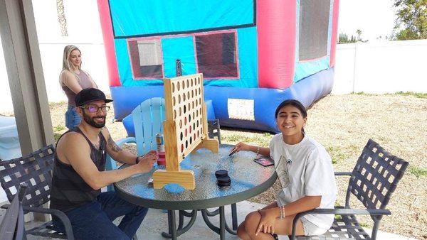 Family playing with the Connect 4