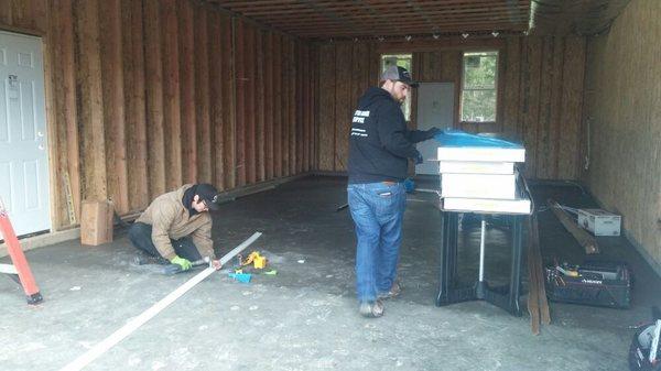 Cory and Jeremy begin staging for a 16' x 8' door.