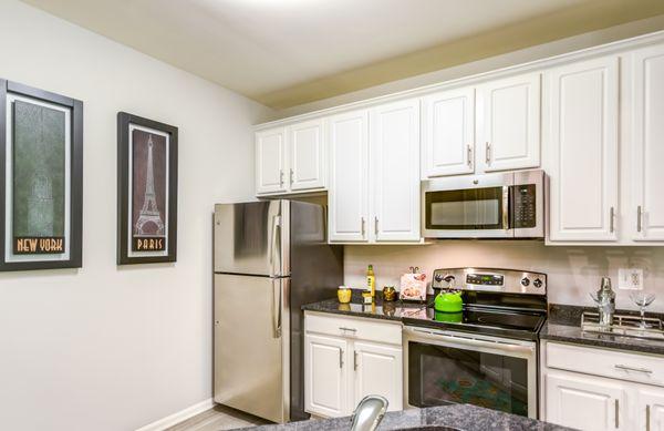 Stainless steel appliances, stone counter tops, clean white cabinetry -- it's everything you wanted in a new home