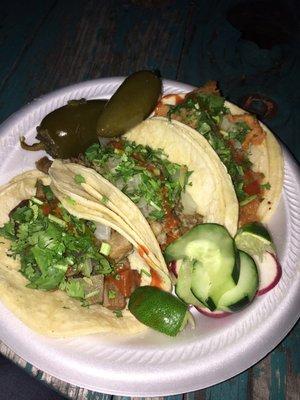 Lengua, chicharron, and Cabeza tacos. Needs more flavor