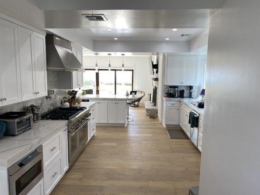 Remodeled kitchen with new appliances, custom cabinets and flooring