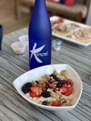 Steel cut oatmeal with granola and berries.