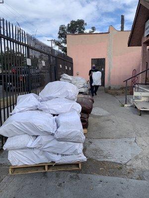 My husband grabbing our wood after we paid inside the office.