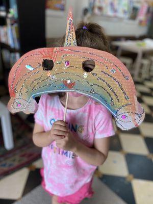 A rainbow unicorn mask.